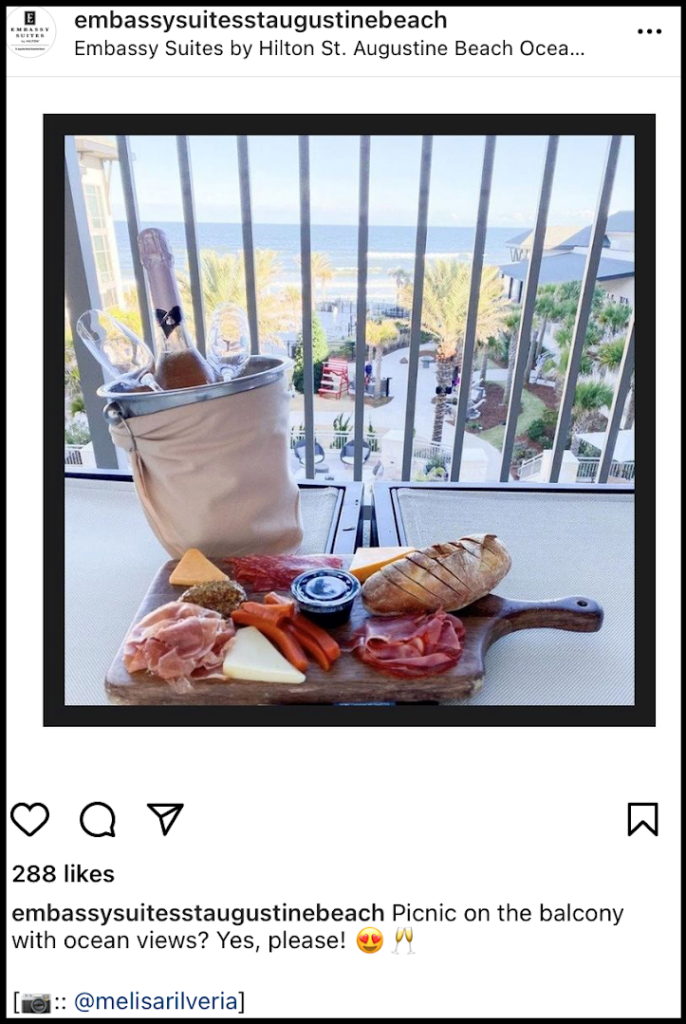 social media post of hotel balcony view and charcuterie board