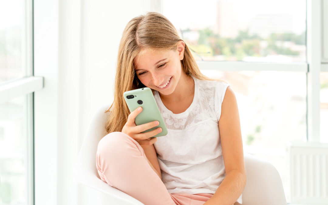 teen-girl-spending-leisure-with-her-phone-indoors